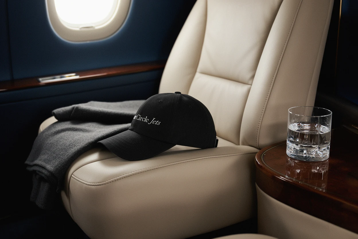 A cream leather cabin seat with an Inner Circle Jets cap